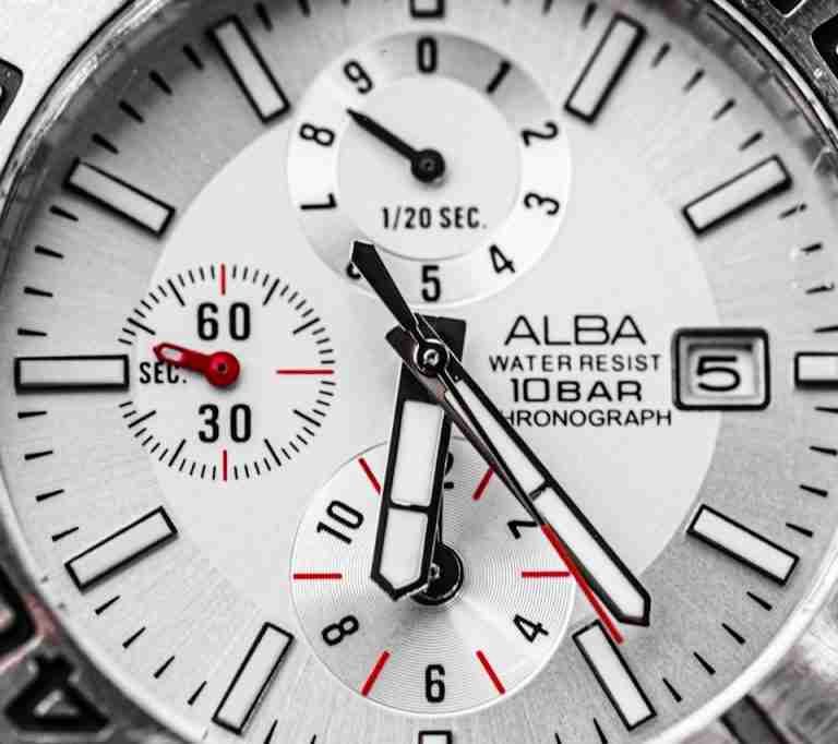 Detailed macro shot of an Alba chronograph watch face showcasing precision engineering.