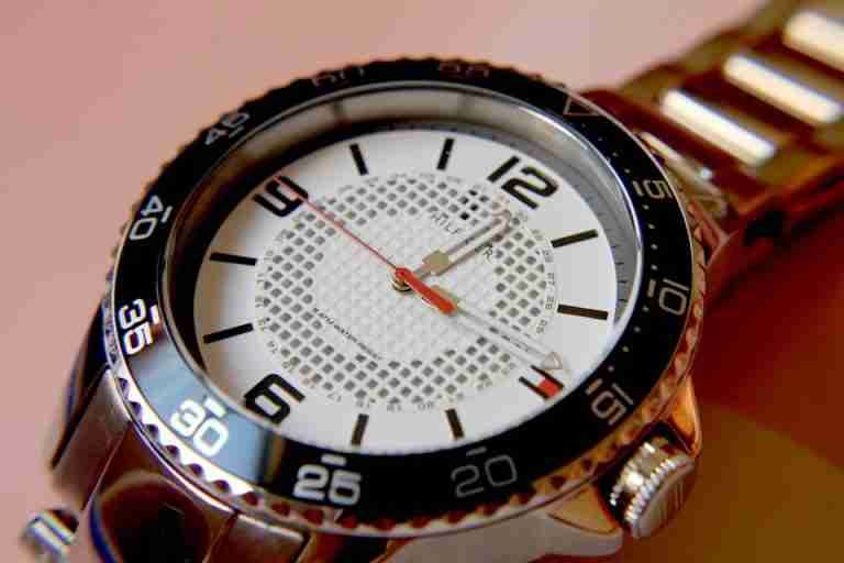 Close-up of an elegant wristwatch showcasing its precise design and timekeeping elements.