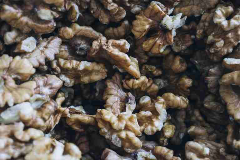 Detailed close-up of shelled walnuts showcasing their rich texture and natural colors.