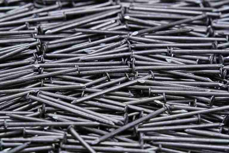 High-resolution image of numerous metal nails arranged closely together.
