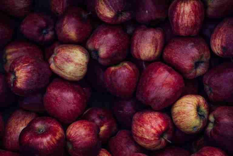 A pile of fresh, red apples perfect for healthy eating in autumn.