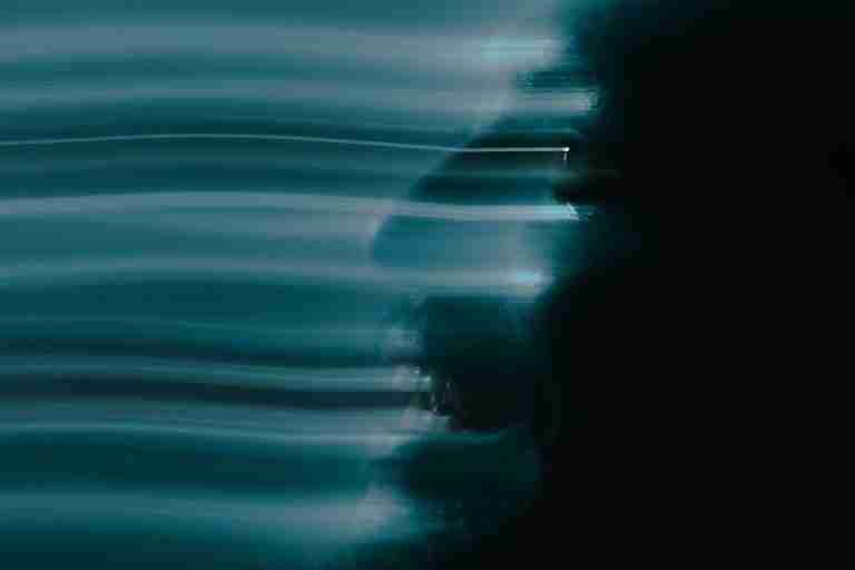 Artistic abstract portrait of a man's face using motion blur for a spooky and creative effect.
